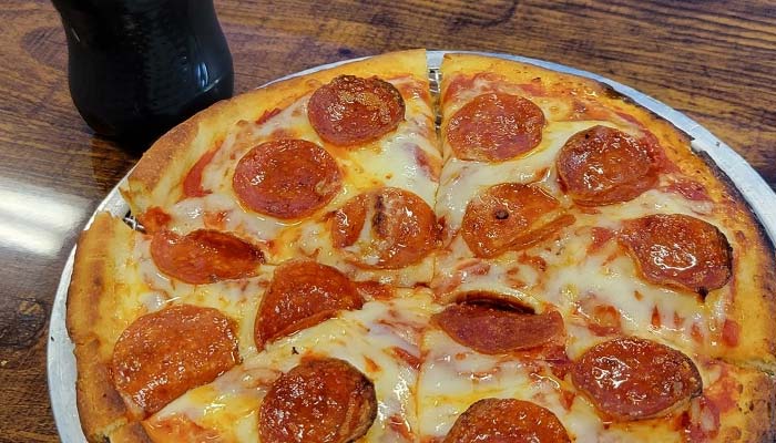 Personal pepperoni pizza and cola soda soft drink served at Fire n Ice in Murrysville, PA.