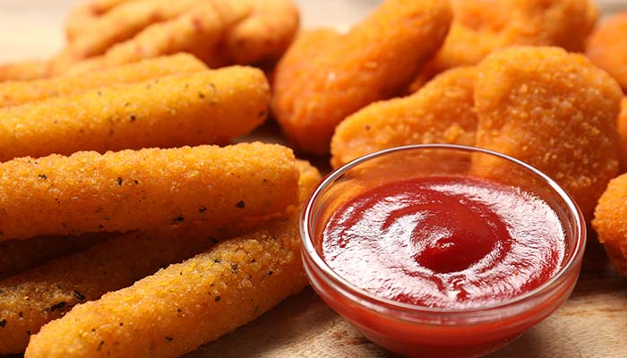 Mozzarella cheese sticks and side cup of marinara dipping sauce served from the Fire n Ice snack menu in Murrysville, PA.