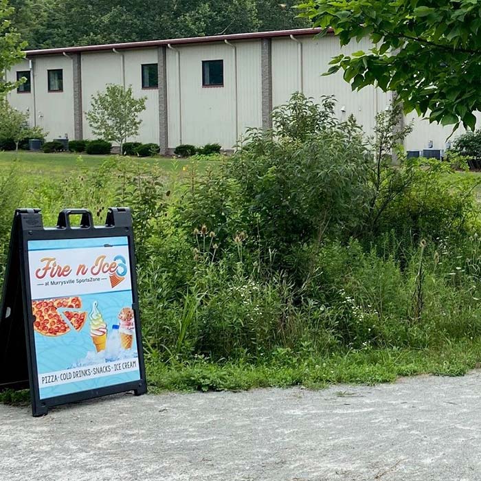 Entrance from the WHT trail path leading to Fire n Ice ice cream and snack shop in Central Murrysville, Pennsylvania.